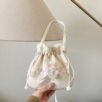 Youxuan уличен стил платнена bucket bag с капак; затваряне с връзка; подплата полиестер; презрамка единична