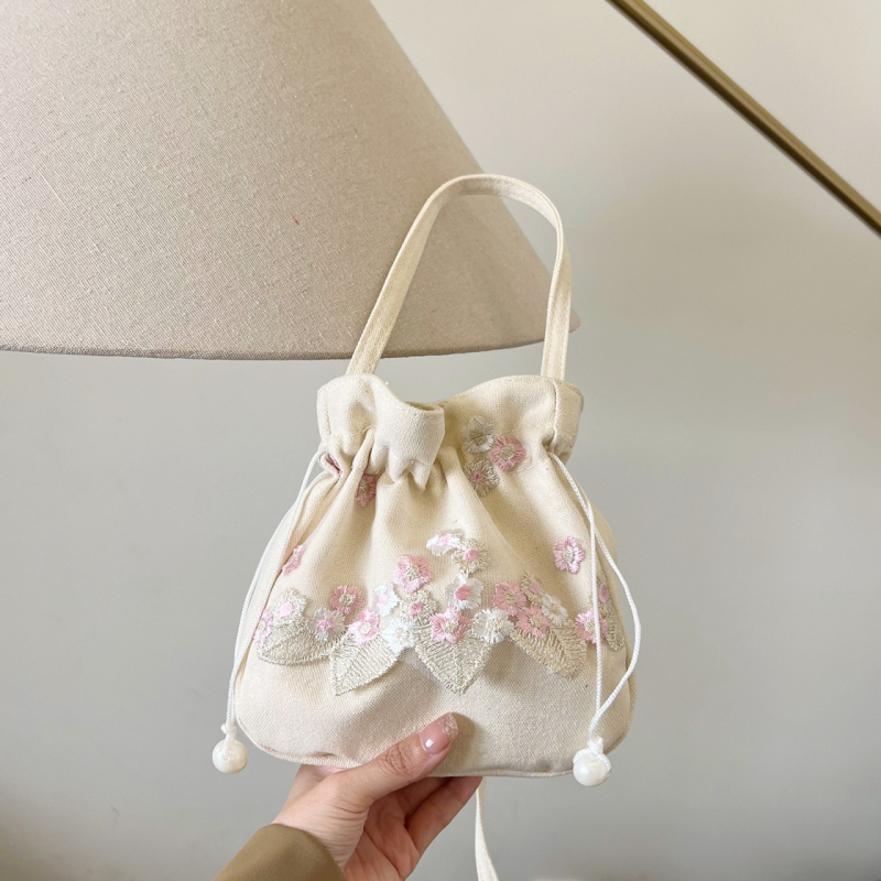 Youxuan уличен стил платнена bucket bag с капак; затваряне с връзка; подплата полиестер; презрамка единична