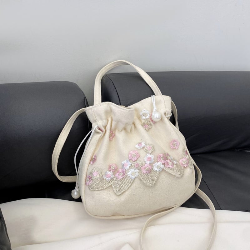 Youxuan уличен стил платнена bucket bag с капак; затваряне с връзка; подплата полиестер; презрамка единична