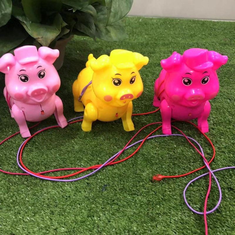 Xue Qun šviesus traukiamas kiaulės žaislas — plastmasinis, šviesos funkcija, vaikams 4–6 metai