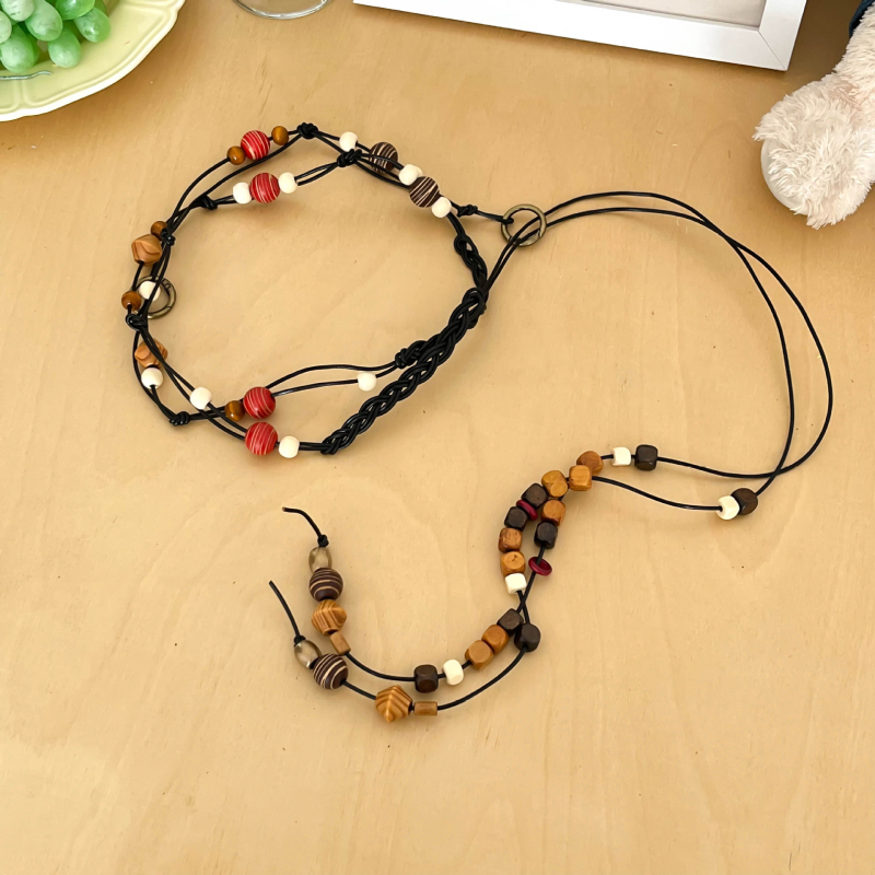 Hosszú szövött tehénbőrből készült derékzsinór gyöngyökkel, egyszerű stílus, kampó zárás, kagylócsattal