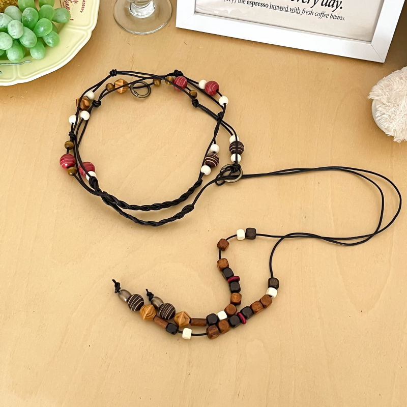 Hosszú szövött tehénbőrből készült derékzsinór gyöngyökkel, egyszerű stílus, kampó zárás, kagylócsattal