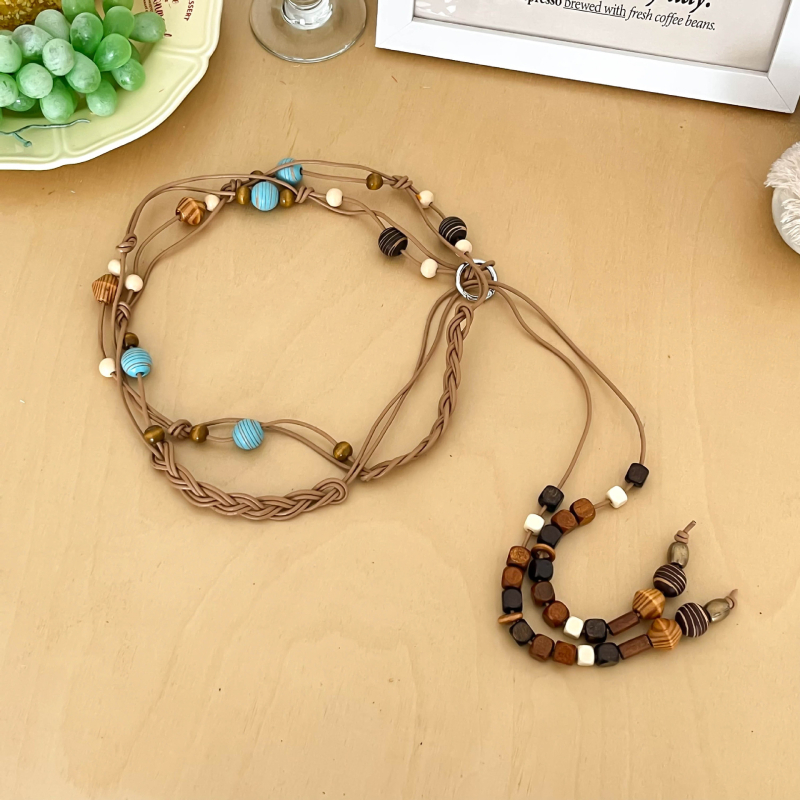 Hosszú szövött tehénbőrből készült derékzsinór gyöngyökkel, egyszerű stílus, kampó zárás, kagylócsattal