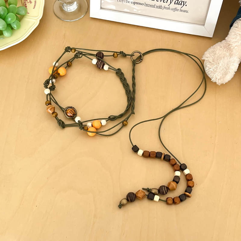 Hosszú szövött tehénbőrből készült derékzsinór gyöngyökkel, egyszerű stílus, kampó zárás, kagylócsattal