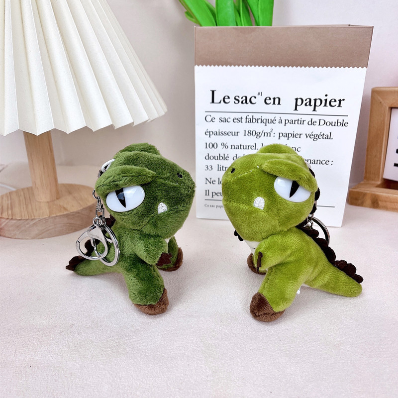 Plišani ključni lanac s dinosaurom, moderan minimalistički stil