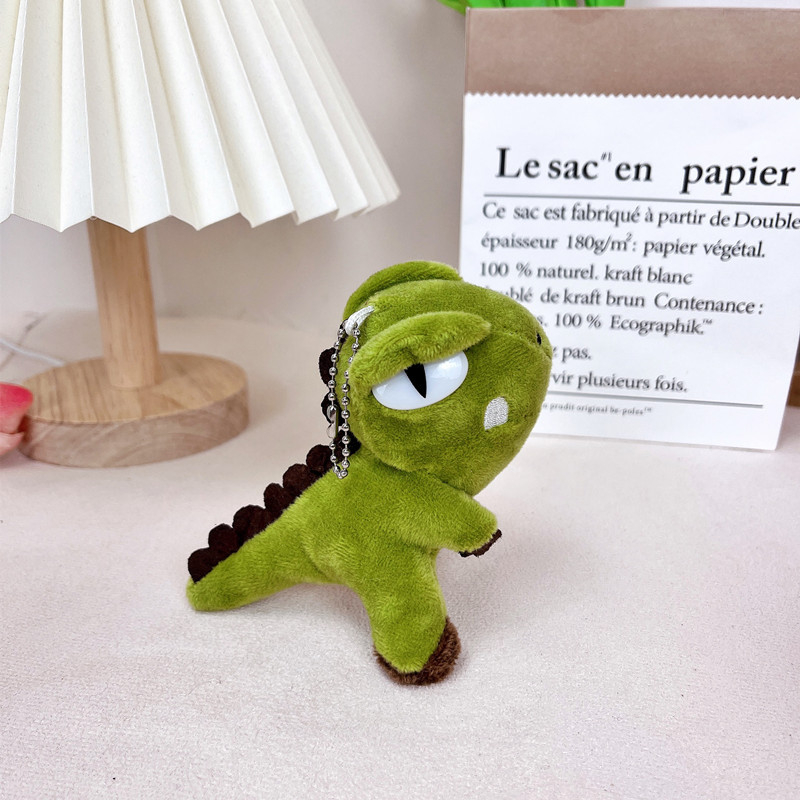 Plišani ključni lanac s dinosaurom, moderan minimalistički stil