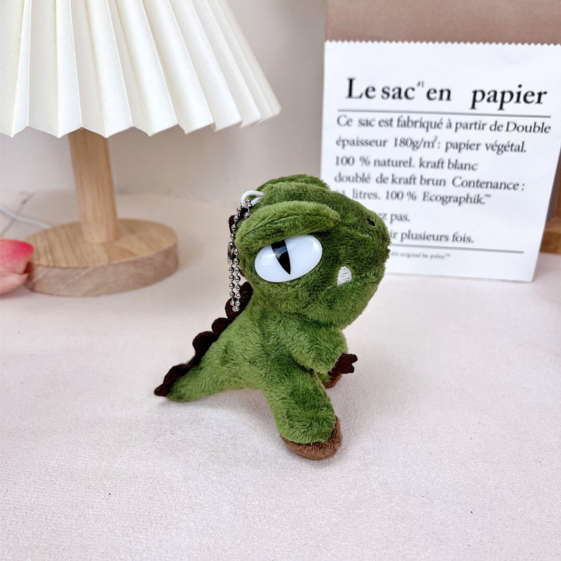 Plišani ključni lanac s dinosaurom, moderan minimalistički stil
