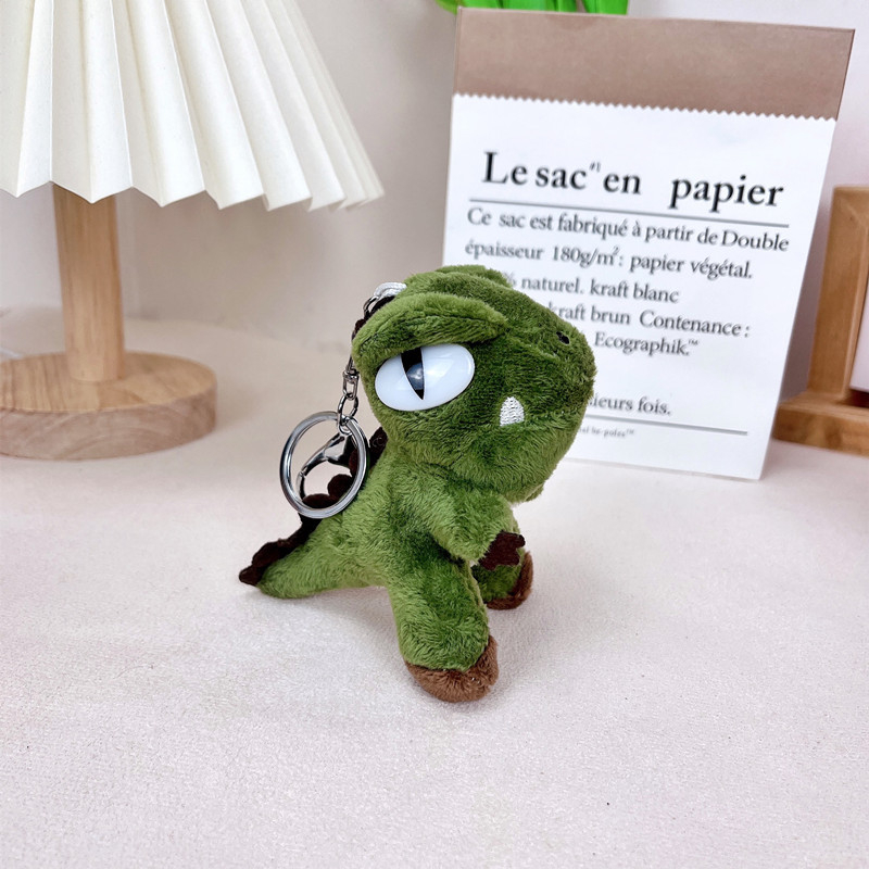 Plišani ključni lanac s dinosaurom, moderan minimalistički stil