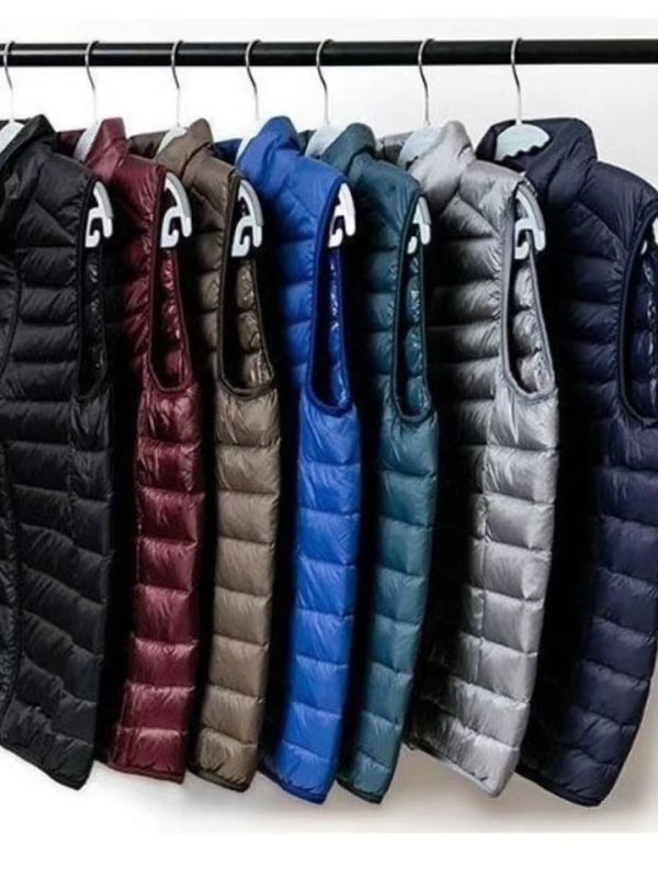 Vyrams skirta lengva medvilnės užpildyta be rankovių liemenė su nailonu išorėje, poliesterio pamušalas, laisvas kirpimas