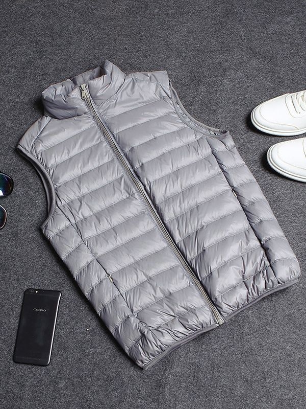 Vyrams skirta lengva medvilnės užpildyta be rankovių liemenė su nailonu išorėje, poliesterio pamušalas, laisvas kirpimas