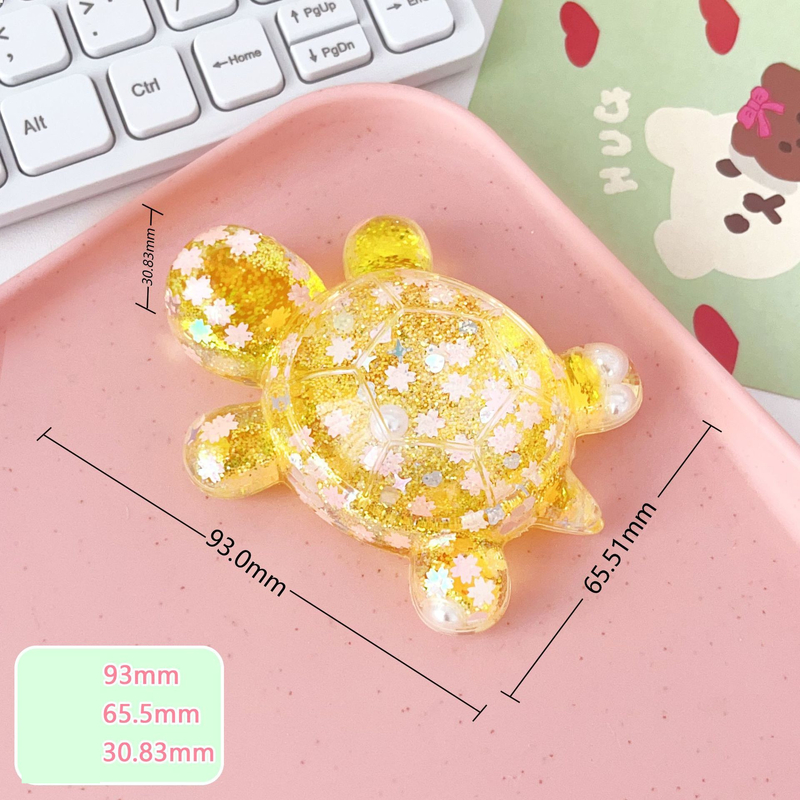 Särav tähistaevas liivast koomiksi suur kilpkonnakujuke otseülekande pimedate kottide sobitamine kontorilaua kaunistuste hulgimüük