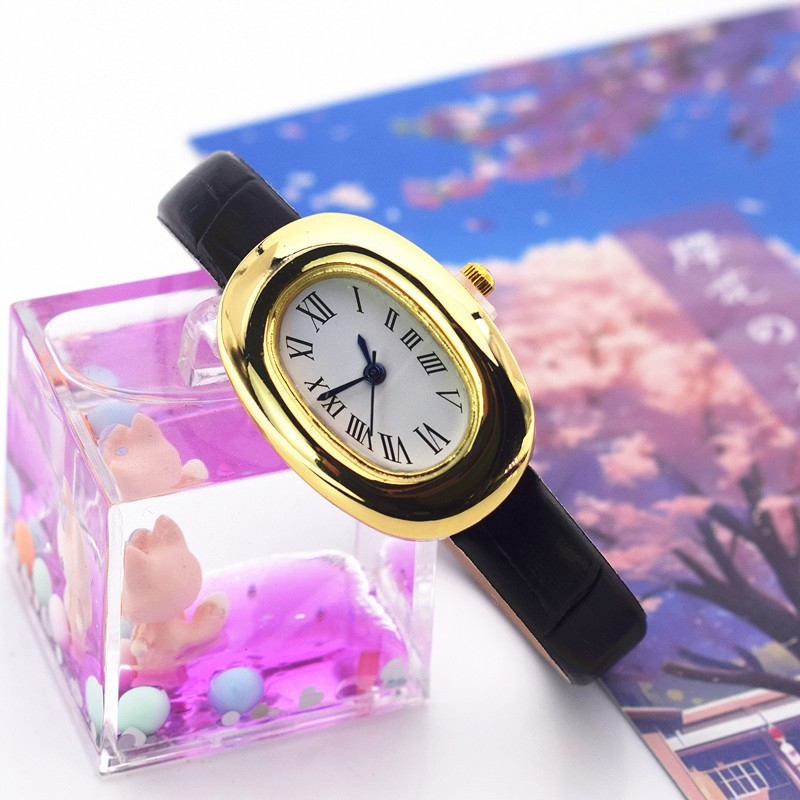 Női óra ovális számlappal, imitált bőrszíjjal — kvarc mozgás, analóg kijelző, tok ötvözetből