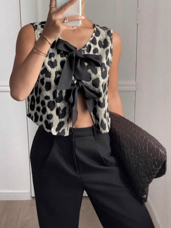 Leopardų print vestas su raišteliais, siauras siluetas, vidutinio ilgio 50–65 cm, poliesteris su elastanu