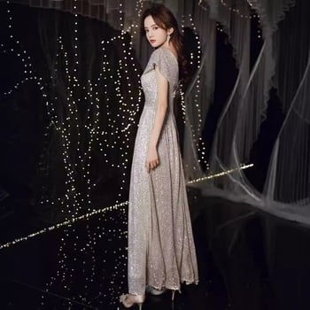 Rochie de seară cu decolteu în V și paiete, siluetă prințesă cu bustle, talie înaltă, fustă lungă, mâneci 3/4