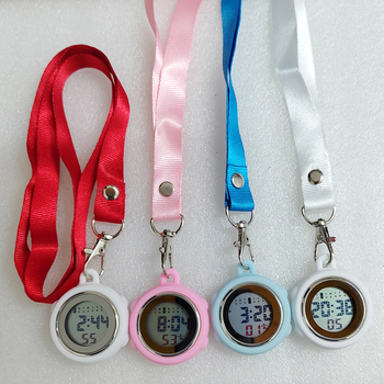 Aprūpes fob pulkstenis ar auklu, elektronisks digitālais pulkstenis, apļveida cinka sakausējuma korpuss, digitālais displejs, kalendārs ar 24 stundu rādījumu, nedēļa un mēnesis, gaismas ciparnīca