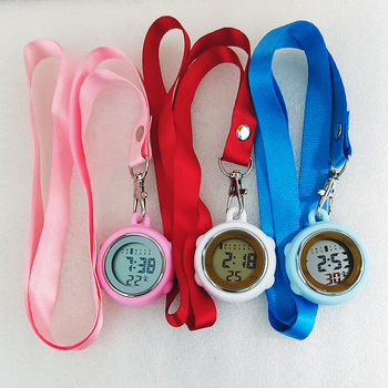 Aprūpes fob pulkstenis ar auklu, elektronisks digitālais pulkstenis, apļveida cinka sakausējuma korpuss, digitālais displejs, kalendārs ar 24 stundu rādījumu, nedēļa un mēnesis, gaismas ciparnīca