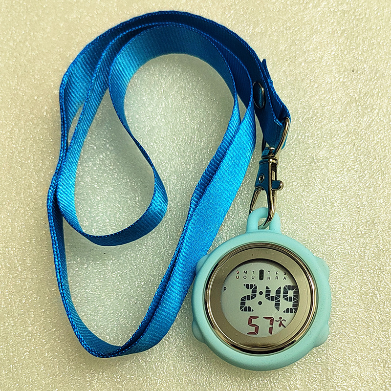 Aprūpes fob pulkstenis ar auklu, elektronisks digitālais pulkstenis, apļveida cinka sakausējuma korpuss, digitālais displejs, kalendārs ar 24 stundu rādījumu, nedēļa un mēnesis, gaismas ciparnīca