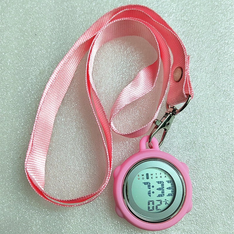 Aprūpes fob pulkstenis ar auklu, elektronisks digitālais pulkstenis, apļveida cinka sakausējuma korpuss, digitālais displejs, kalendārs ar 24 stundu rādījumu, nedēļa un mēnesis, gaismas ciparnīca