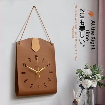 Bőr táskává formázott falióra — egyoldalas, sweep-mozgású, akkumulátoros működés, számozott számlap