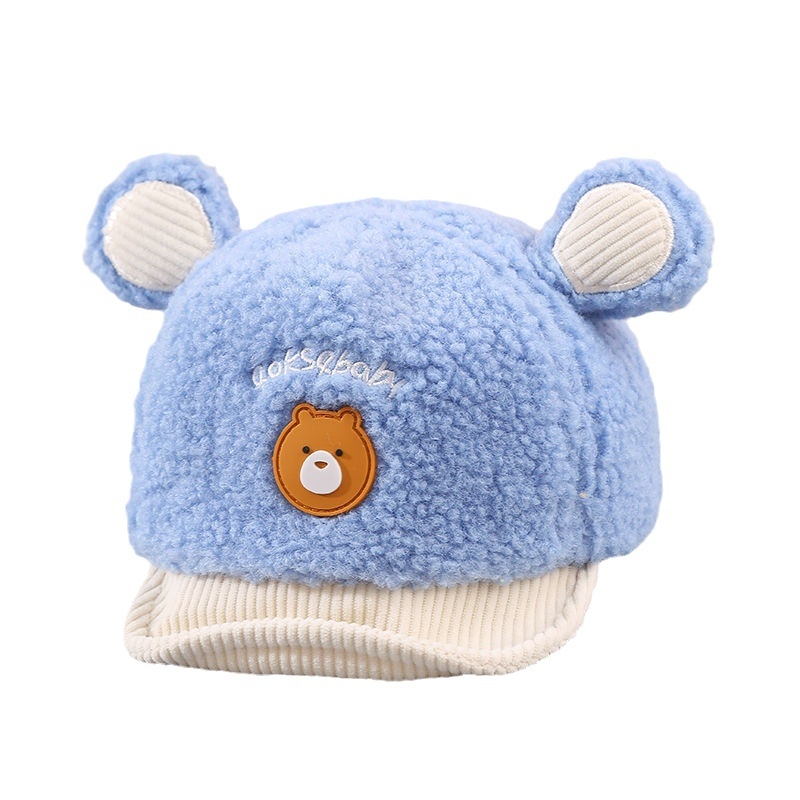 Zīdaiņu cepure no ait vilnas ar kupola formu un īsu malējumu; ausu aizsardzība; elpojoša, silta, pret vēju; 6–12 mēnešus un 1–2 gadus