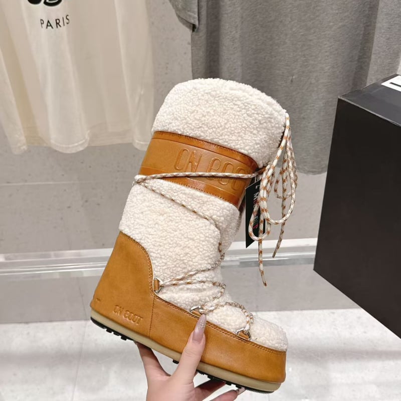 Дамски снежни ботуши с дебела подметка и вътрешно повдигане – средно високи, кръгъл нос, плосък ток; Горна част: тъкан овча вълна и кадифе; Вътрешна част: овча вълна и кадифе; Подметка: пяна гума