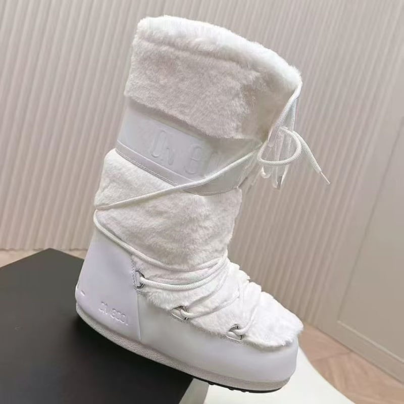 Дамски снежни ботуши с дебела подметка и вътрешно повдигане – средно високи, кръгъл нос, плосък ток; Горна част: тъкан овча вълна и кадифе; Вътрешна част: овча вълна и кадифе; Подметка: пяна гума