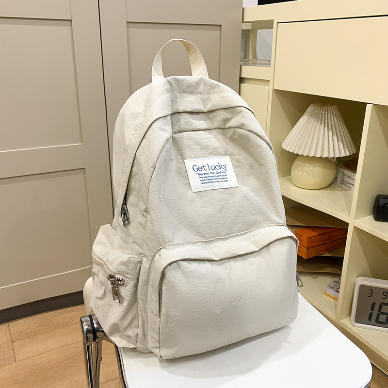 Női iskolai hátizsák, városi minimalist stílus, nylon anyag, kapacitás 20–35L, görbült vállpántok, poliészter bélés