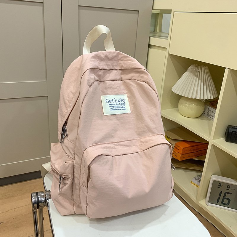 Női iskolai hátizsák, városi minimalist stílus, nylon anyag, kapacitás 20–35L, görbült vállpántok, poliészter bélés