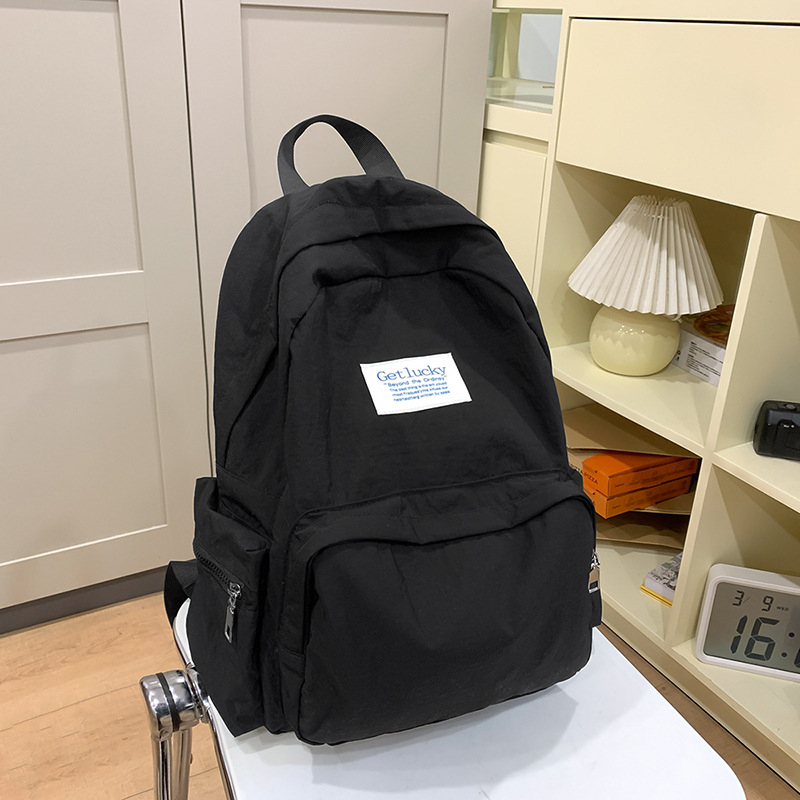 Női iskolai hátizsák, városi minimalist stílus, nylon anyag, kapacitás 20–35L, görbült vállpántok, poliészter bélés