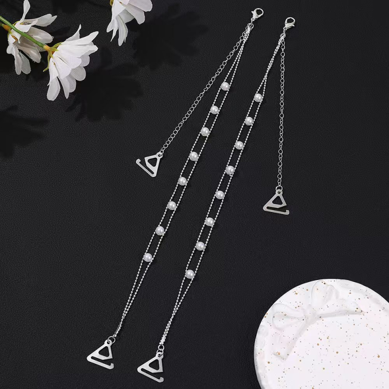 Plecu siksna apģērbam ar neizskatāmiem kristāliem un metāla pērlēm • Materiāls: titāna tērauds • Stils kods: 22105853830 • Izlaidums: 2024. gada vasara • Virsma: gluda, draudzīga ādai