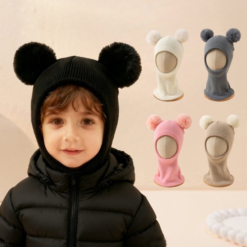 Megztos žieminės vaikų kepurė su ausų apsauga ir integruotu kaklo šaliku, kupolo formos, kraštas žemyn, palaiko šilumą ir vėjo atsparumą, vaikams 6–12 mėnesių ir 1–2 metų