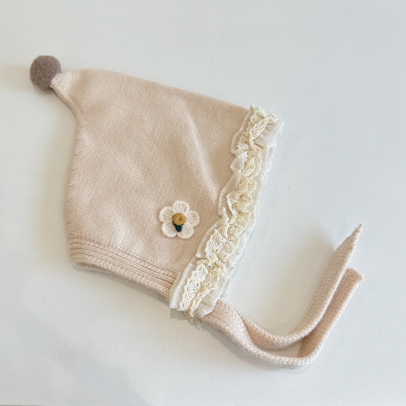 Laste talvemüts kaheskiire kõrvakaitsega, lille- ja tähtmotiiv, tuulekindel, tie-dye efektiga kudum, vanus 6–12 kuud ja 1–2 aastat; võlur-mütsi stiil