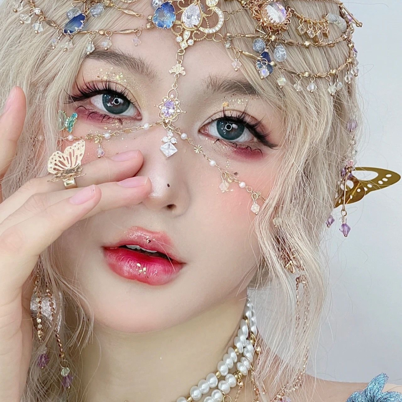 Etnopeakaunistus bojtidega ja veetilja kujulise otsmiku dekoratsiooniga, juukseklips, elektroplaaditud sulam