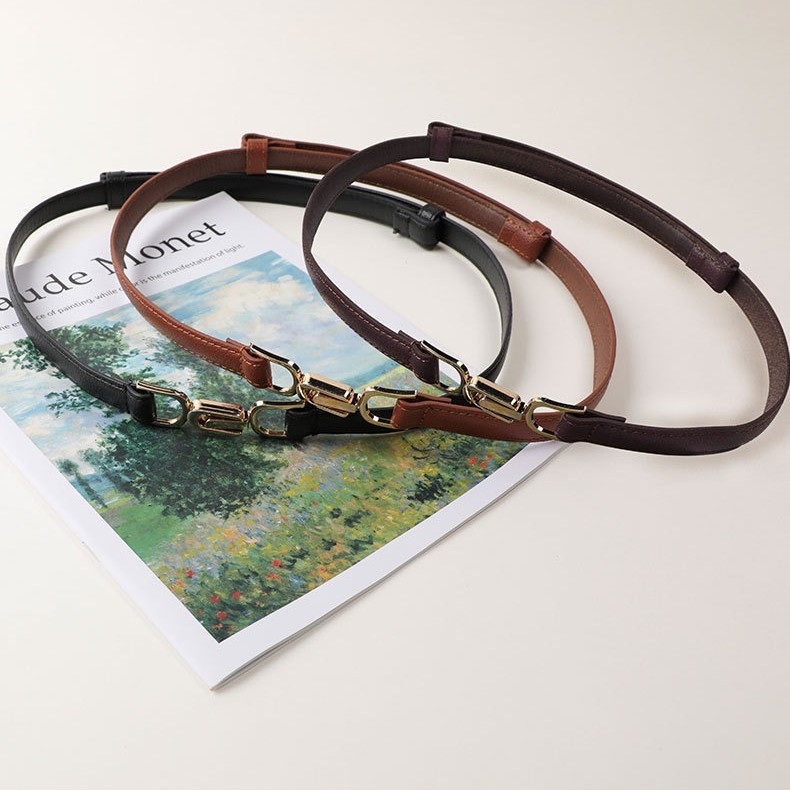 Övvel ellátott ruha műbőrből, övcsat ötvözetből, gombos zárás, elektroplakolás, márka An yulan