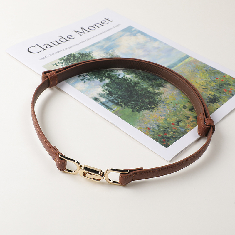 Övvel ellátott ruha műbőrből, övcsat ötvözetből, gombos zárás, elektroplakolás, márka An yulan