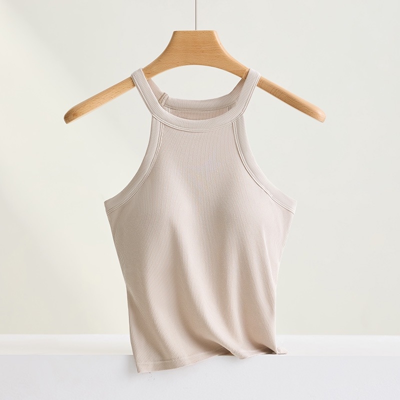 Halter top s ugrađenim pamukastim jastučićima; materijal: viskoza (95–100% viskoze); debljina tkanine: umjerena (181–200 g/m²); izrez: kružni; stil: halter, svestran