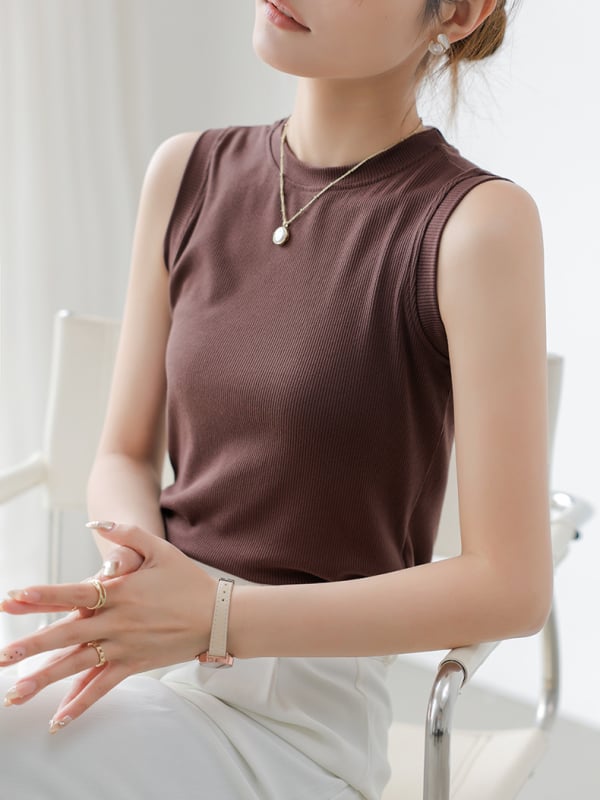 Pamučna kamizola, uska silueta, prugasti ili karirani uzorak, duljina 50–65 cm, ljeto 2025