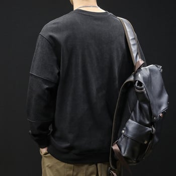 Férfi fleece pulóver patchwork dizájnnal, kerek nyakú, laza szabású, poliészter 93,5% + elasztán 6,5%, tavasz–őszre.