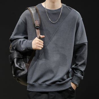 Férfi fleece pulóver patchwork dizájnnal, kerek nyakú, laza szabású, poliészter 93,5% + elasztán 6,5%, tavasz–őszre.