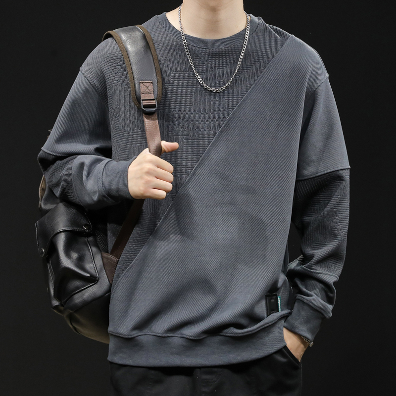 Férfi fleece pulóver patchwork dizájnnal, kerek nyakú, laza szabású, poliészter 93,5% + elasztán 6,5%, tavasz–őszre.