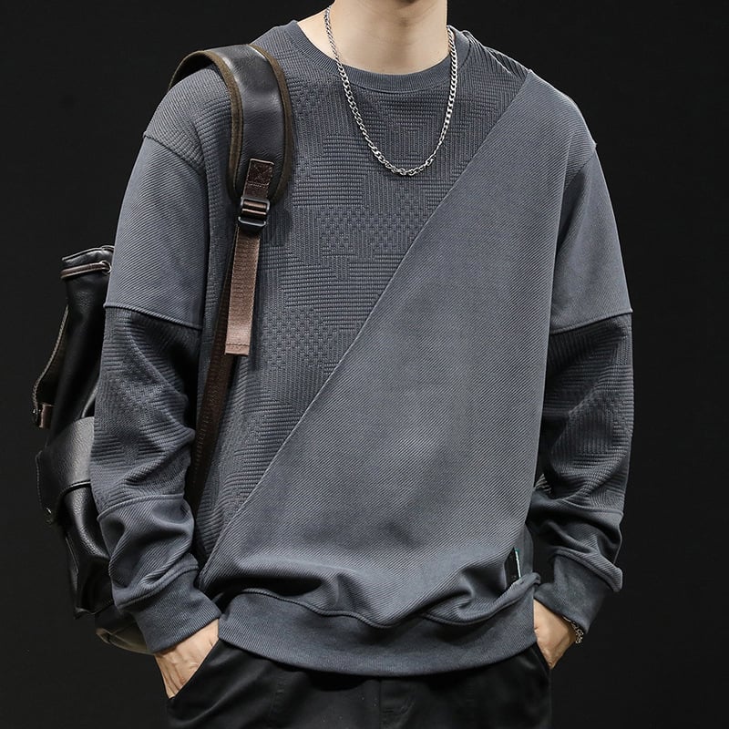 Férfi fleece pulóver patchwork dizájnnal, kerek nyakú, laza szabású, poliészter 93,5% + elasztán 6,5%, tavasz–őszre.