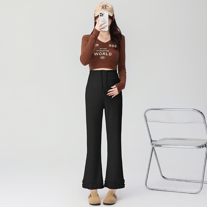 Pantaloni de maternitate cu talie înaltă, călduroși cu căptușeală fleece interioară, din amestec bumbac-poliester cu 50–70% elastan, lungime 9/10, croială lejeră