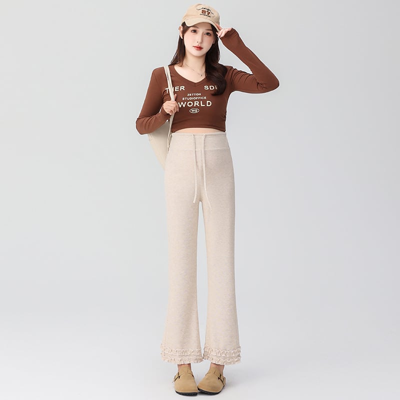 Pantaloni de maternitate cu talie înaltă, călduroși cu căptușeală fleece interioară, din amestec bumbac-poliester cu 50–70% elastan, lungime 9/10, croială lejeră