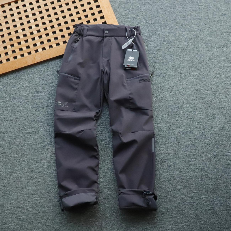 Muške hlače s fleece podstavom, vjetro i vodonepropusne, ravnog kroja, srednji pojas, poliester, mikroelastičnost, s podesivim manžetama na nogavicama