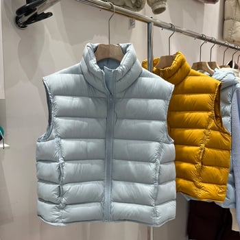 Női tollmellény, rövid fazon, álló gallér, 86–90% fehér kacsa tollpihé, poliészter