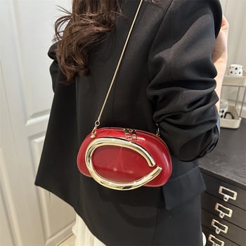 Ženska crossbody torba tipa kutija s metalnim detaljima — zatvarač, ovalni oblik, poliester podstava
