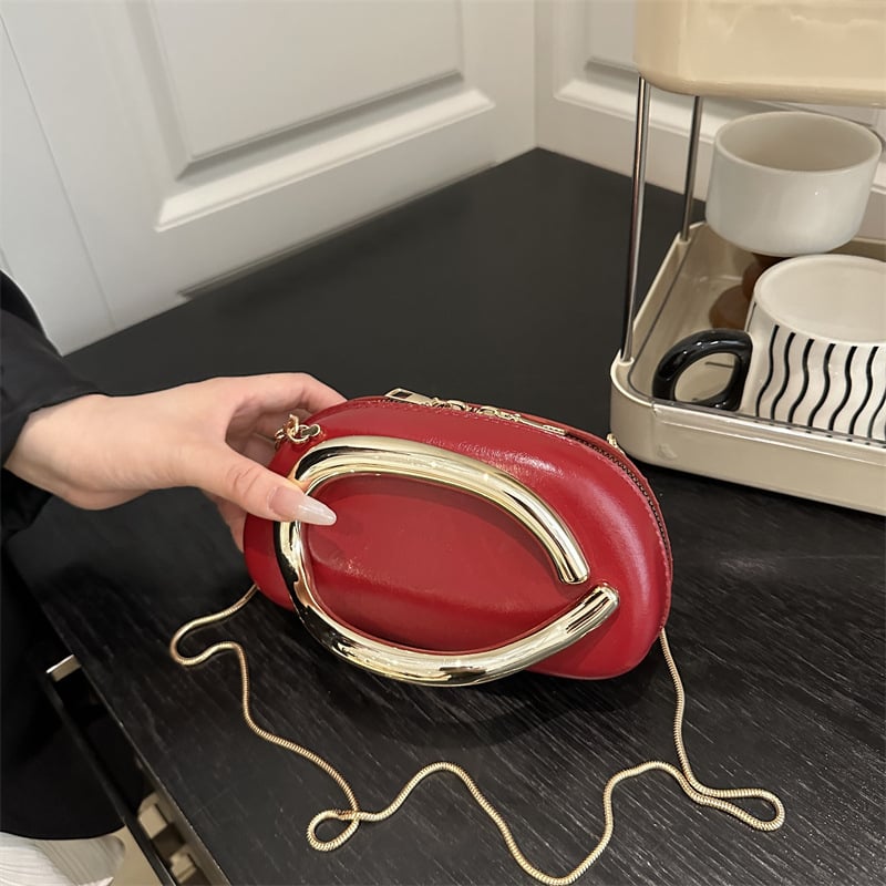 Ženska crossbody torba tipa kutija s metalnim detaljima — zatvarač, ovalni oblik, poliester podstava