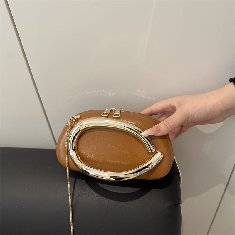 Ženska crossbody torba tipa kutija s metalnim detaljima — zatvarač, ovalni oblik, poliester podstava