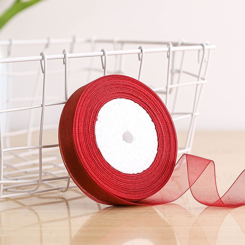 Dekoratyvinė juostelė - 50% viskozės ir 50% dirbtinės medvilnės mišinys; skirta drabužiams, namų tekstilei ir pramoninei naudojimui