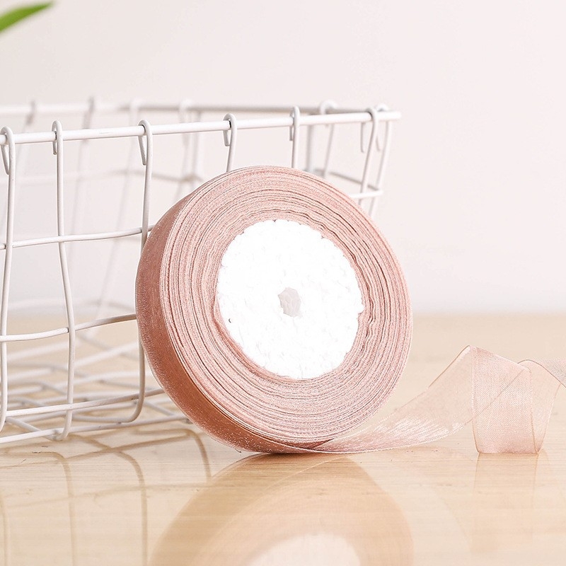 Dekoratyvinė juostelė - 50% viskozės ir 50% dirbtinės medvilnės mišinys; skirta drabužiams, namų tekstilei ir pramoninei naudojimui